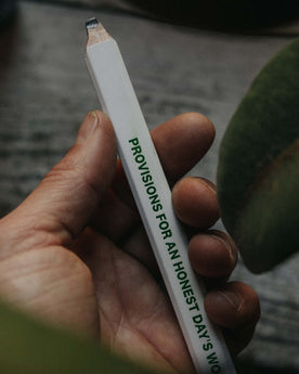 editorial image of model holding The Good Acre Carpenter Pencil (3-Pack), Accessories by Taylor Stitch