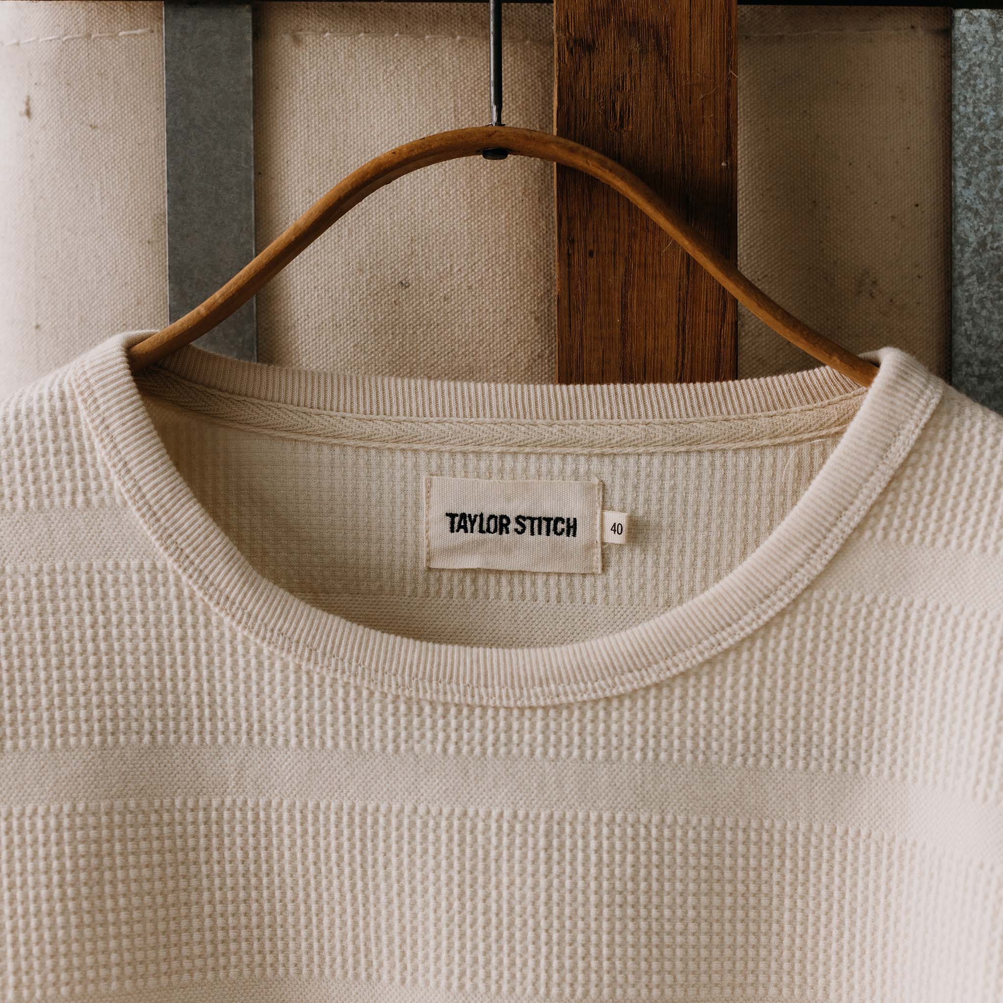 editorial image of The Morgan Crewneck in Natural Slub Stripe on a hanger, Knits by Taylor Stitch
