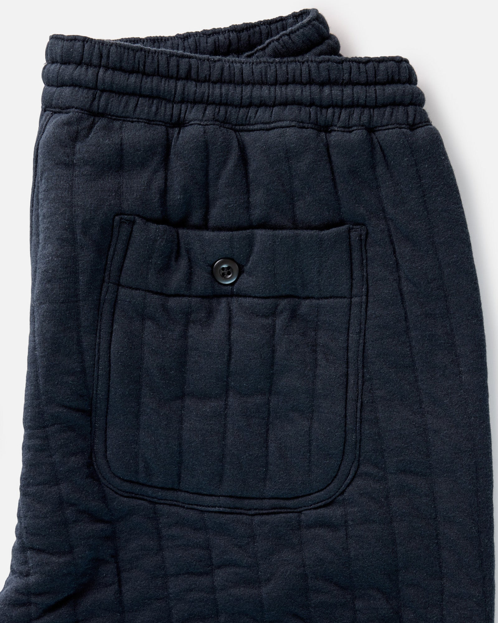 material shot of the waistband on The Quilted Apres Pant in Heather Midnight Jersey, Bottoms by Taylor Stitch
