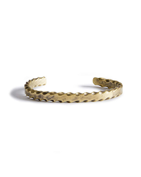 material shot of the front of The Twisted Cuff in Brass