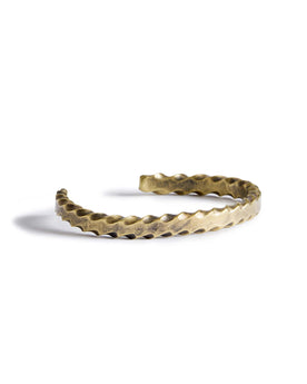 material shot of the side of The Twisted Cuff in Brass, Accessories by Taylor Stitch