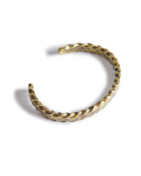 material shot of the top of The Twisted Cuff in Brass, Accessories by Taylor Stitch