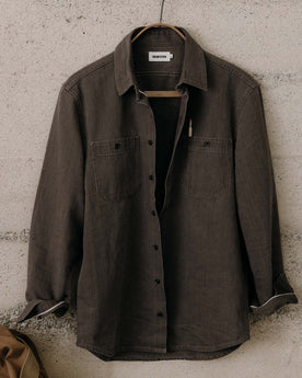 editorial image of The Utility Shirt in Soil Selvedge Denim hanging, Wovens by Taylor Stitch