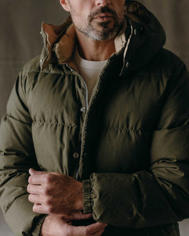 fit model showing off The Down Sweater in Olive Waxed Ripstop, Outerwear by Taylor Stitch