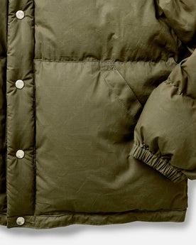 material shot of the cuff on The Down Sweater in Olive Waxed Ripstop, Outerwear by Taylor Stitch