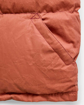 material shot of the pocket on The Down Vest in Brick Red Waxed Ripstop, Outerwear by Taylor Stitch