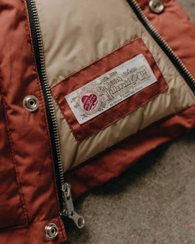 material shot of the inner tag on The Down Vest in Brick Red Waxed Ripstop, Outerwear by Taylor Stitch