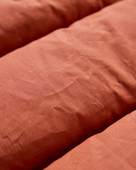 material shot of the fabric on The Down Vest in Brick Red Waxed Ripstop, Outerwear by Taylor Stitch