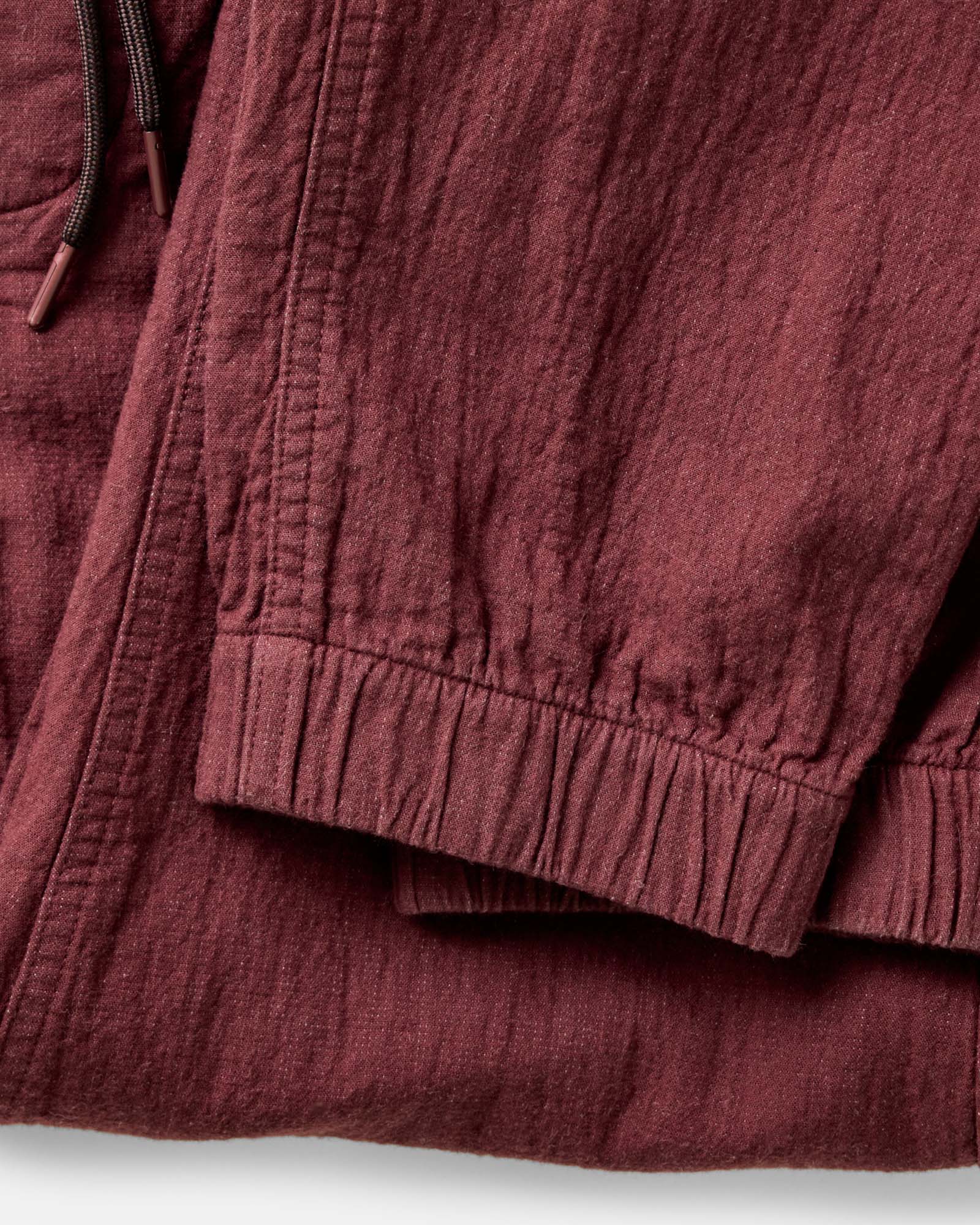 material shot of the cuffs on The Apres Pant in Burgundy Double Cloth, Bottoms by Taylor Stitch