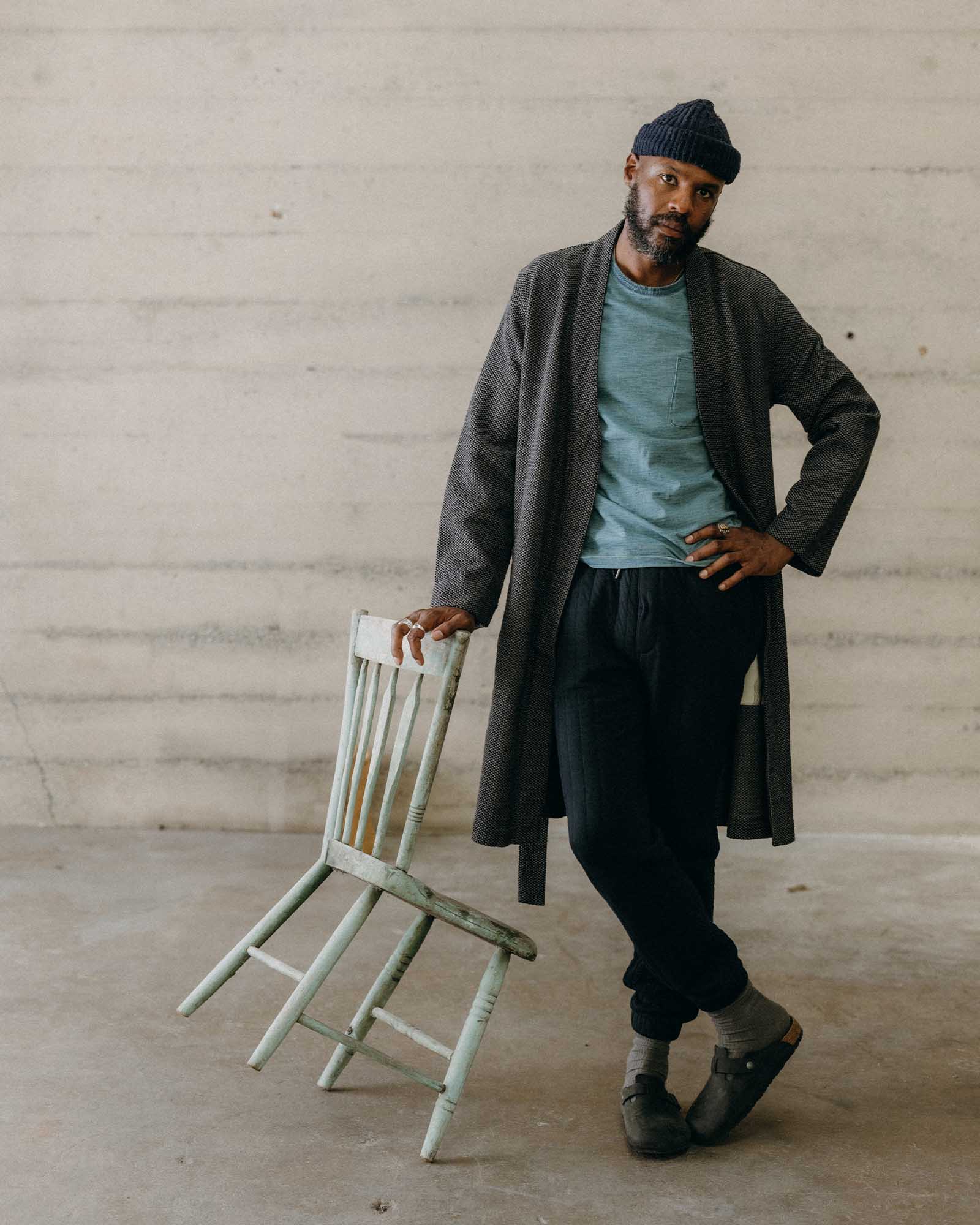 fit model leaning against a chair wearing The Apres Robe in Charcoal Sashiko, Accessories by Taylor Stitch