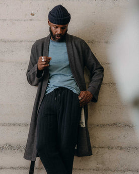 fit model leaning against the wall wearing The Apres Robe in Charcoal Sashiko, Accessories by Taylor Stitch