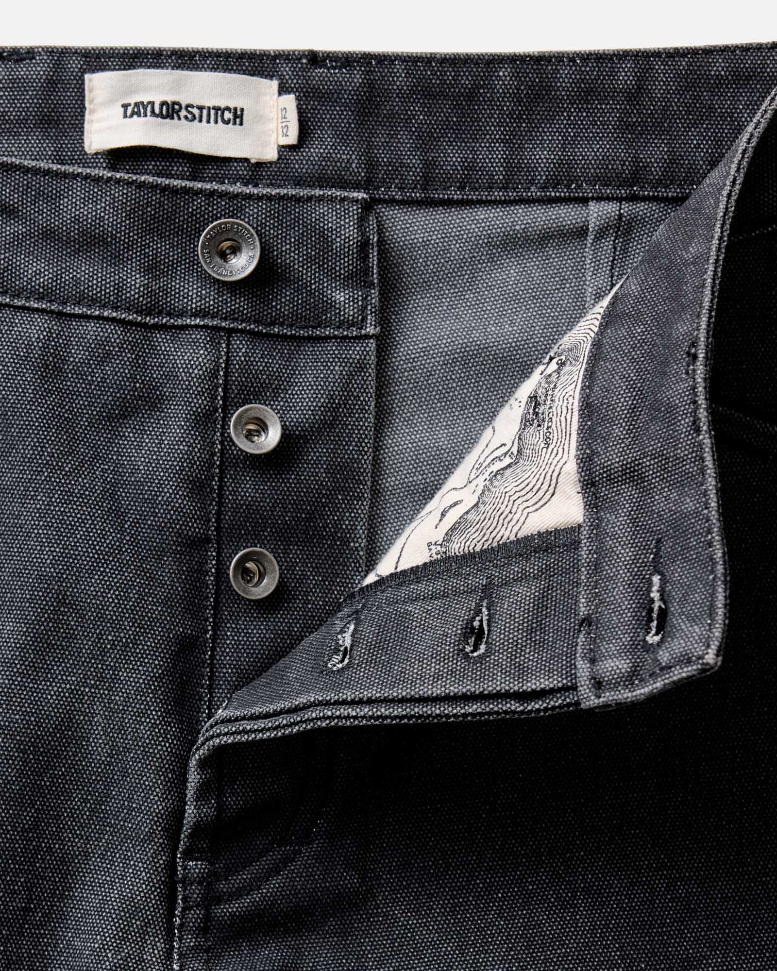 fit model posing in The Camp Pant in Coal Chipped Canvas, Bottoms by Taylor Stitch