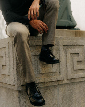 fit model sitting wearing The Carnegie Pant in Gravel Herringbone Wool, Bottoms by Taylor Stitch