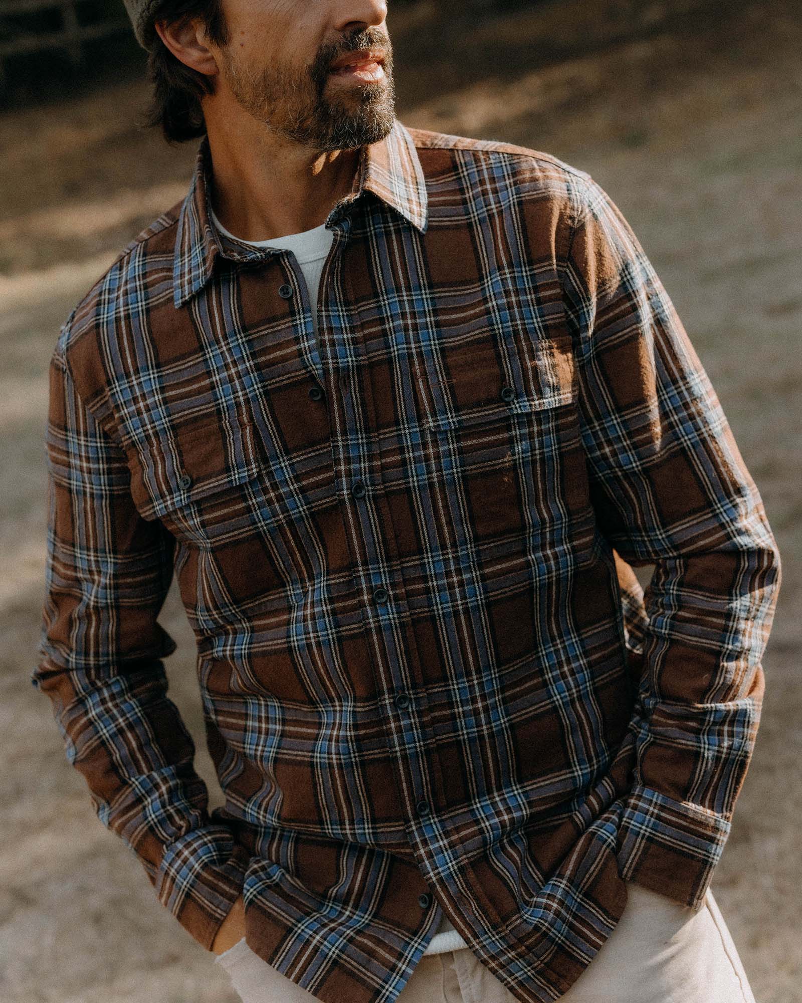 fit model posing in The Craftsman Shirt in Brick Plaid, Wovens by Taylor Stitch