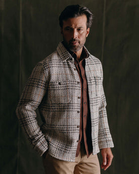 fit model posing in The Cutter Overshirt in Stone Plaid, Wovens by Taylor Stitch