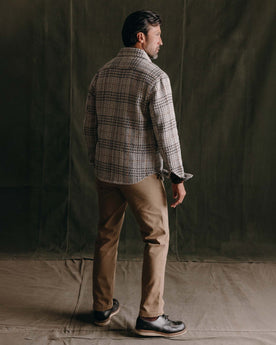 fit model showing off the back of The Cutter Overshirt in Stone Plaid, Wovens by Taylor Stitch