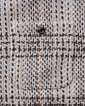 material shot of the pocket on The Cutter Overshirt in Stone Plaid, Wovens by Taylor Stitch