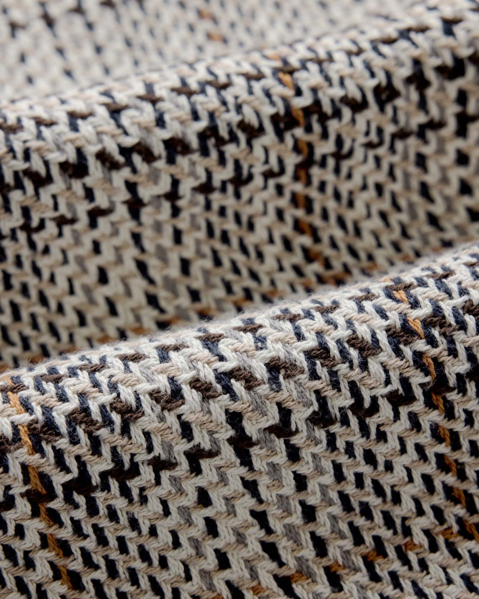 material shot of the fabric on The Cutter Overshirt in Stone Plaid, Wovens by Taylor Stitch