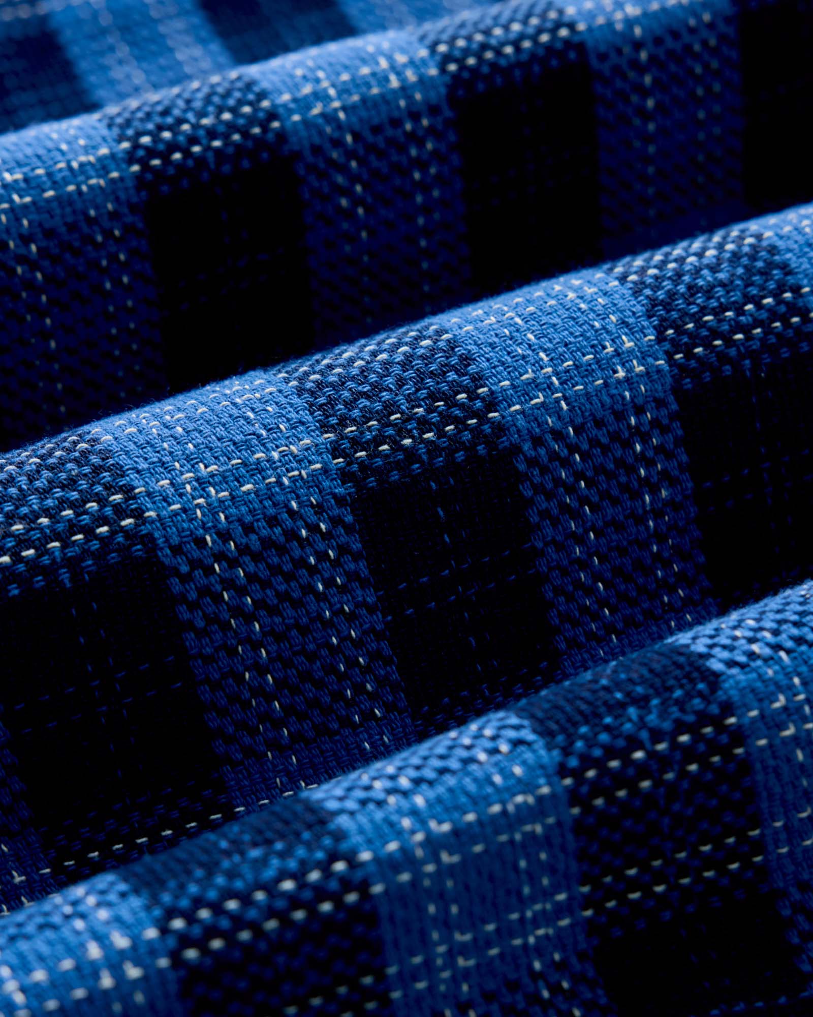 material shot of the fabric on The Division Shirt in Rinsed Indigo Plaid, Wovens by Taylor Stitch