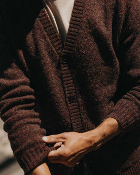 fit model adjusting the sleeves on The Eastmoor Cardigan in Heather Port Wool, Knits by Taylor Stitch