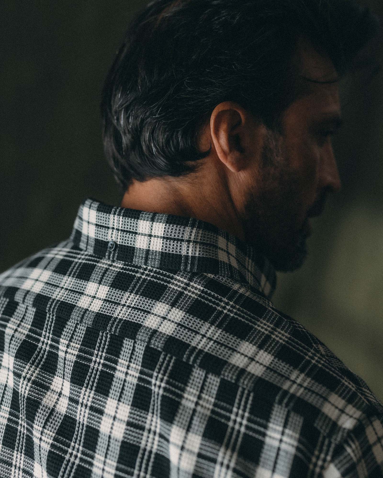 fit model showing off the collar on The Jack in Coal Plaid Waffle, Wovens by Taylor Stitch