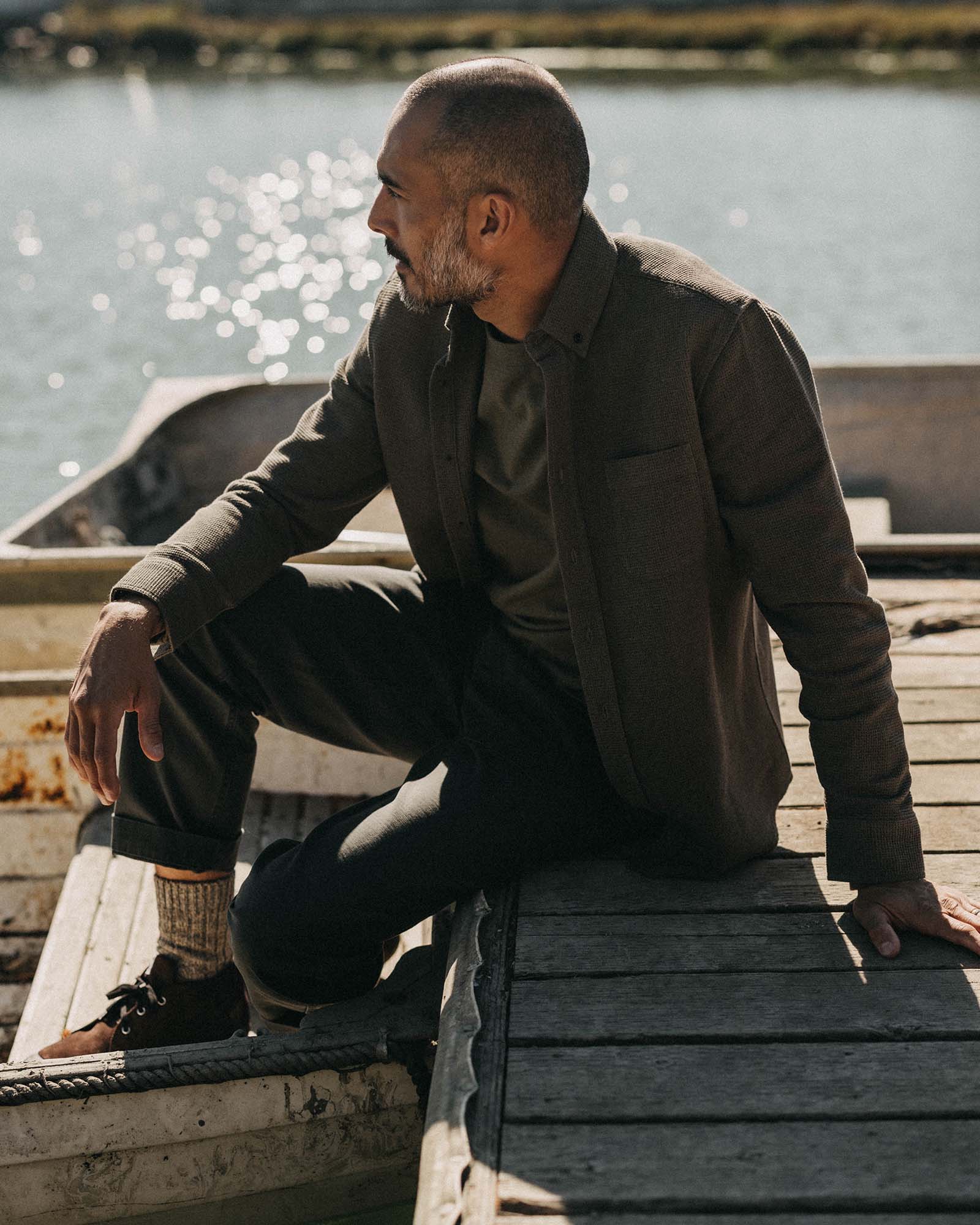 fit model sitting wearing The Jack in Fatigue Olive Waffle, Wovens by Taylor Stitch