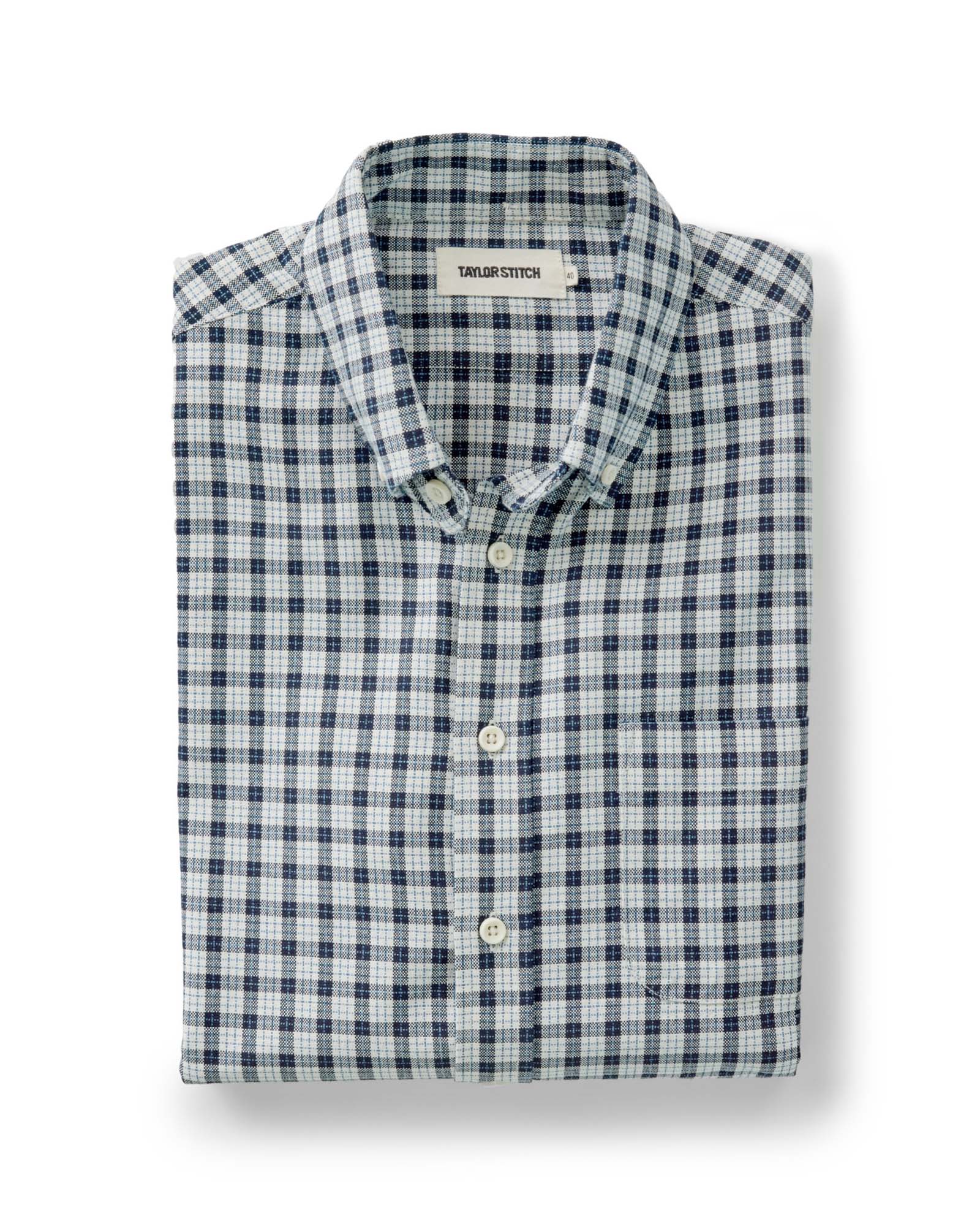 folded flatlay of The Jack in Indigo Micro Check Oxford, Wovens by Taylor Stitch