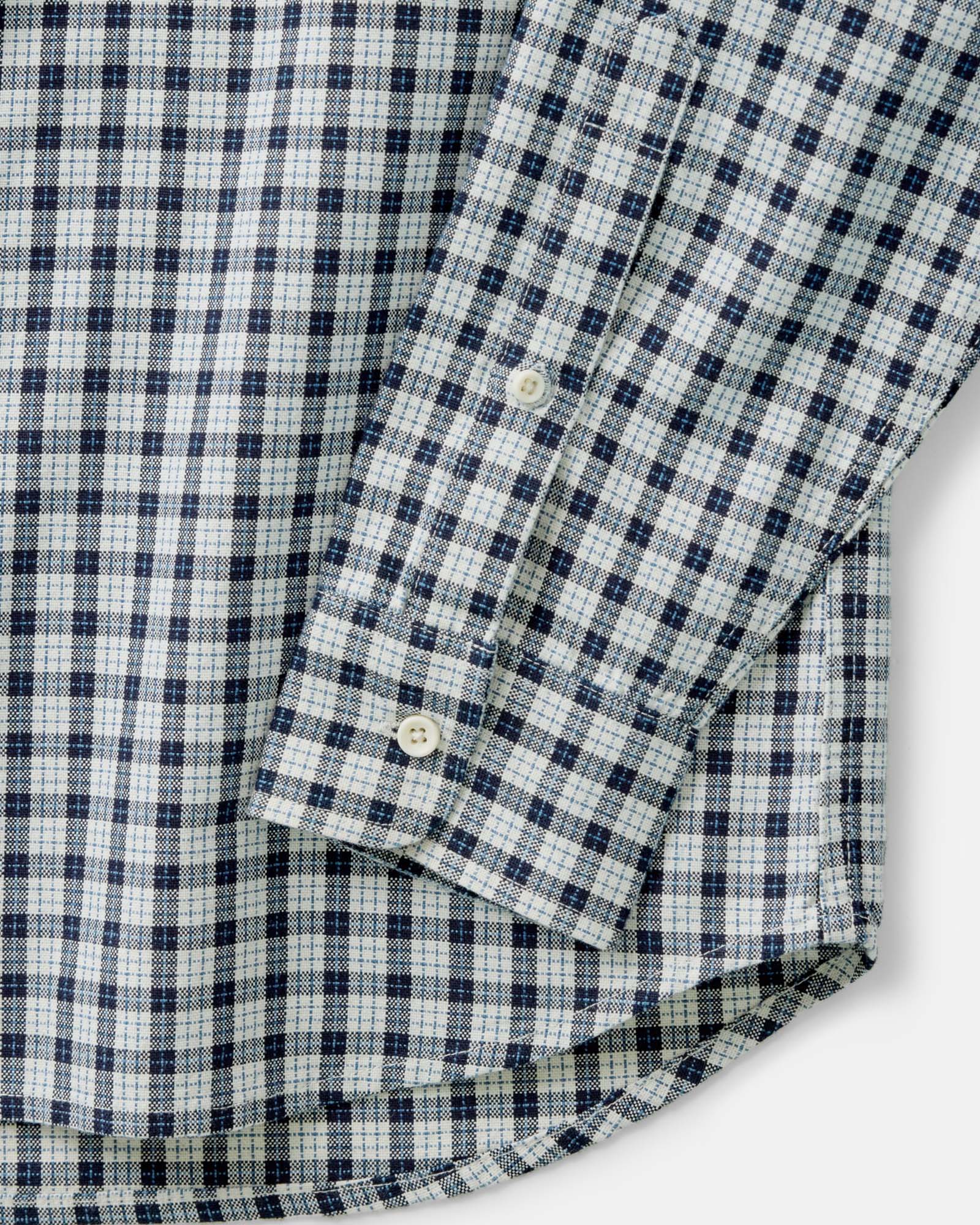 material shot of the sleeve on The Jack in Indigo Micro Check Oxford, Wovens by Taylor Stitch