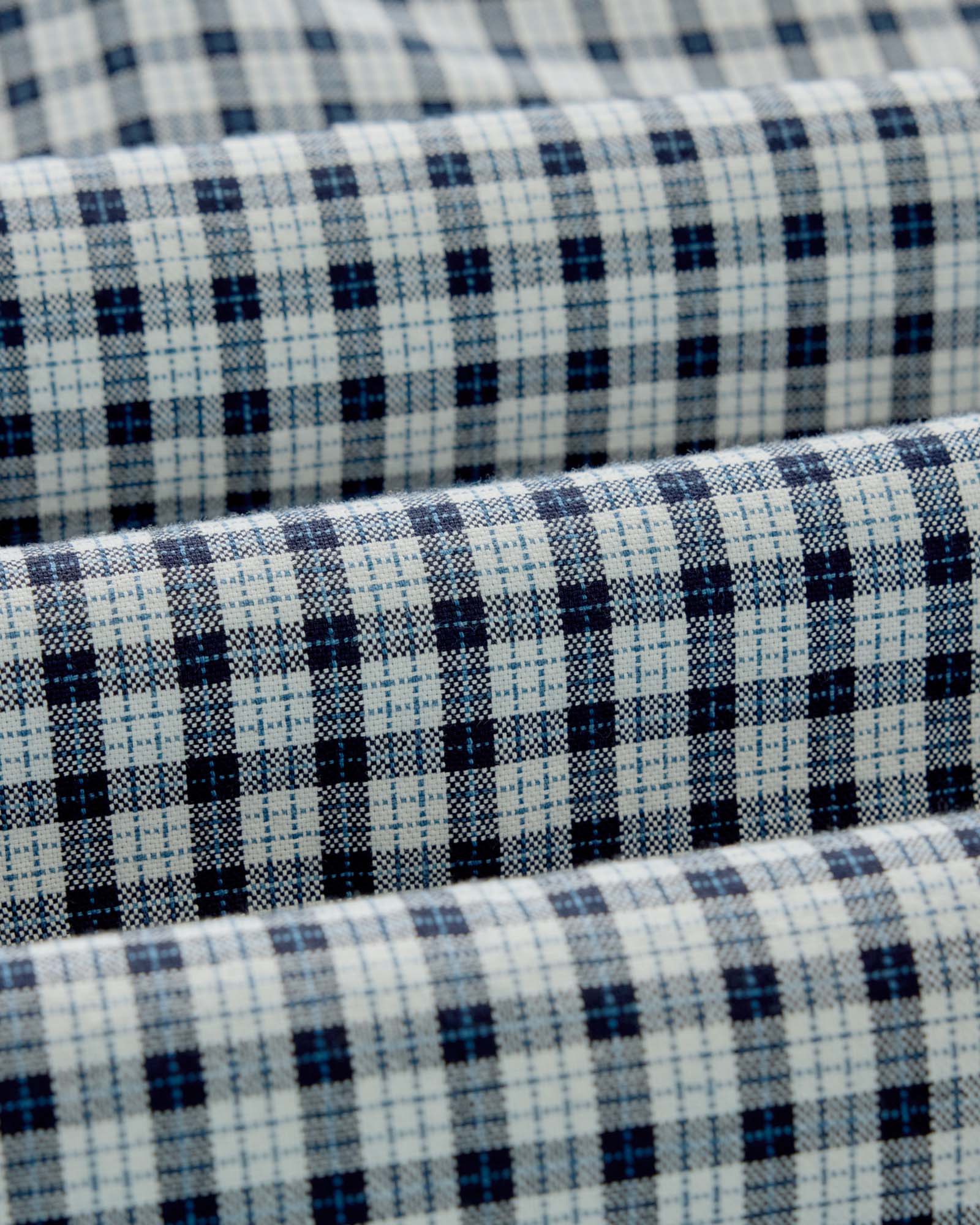 material shot of the fabric on The Jack in Indigo Micro Check Oxford, Wovens by Taylor Stitch