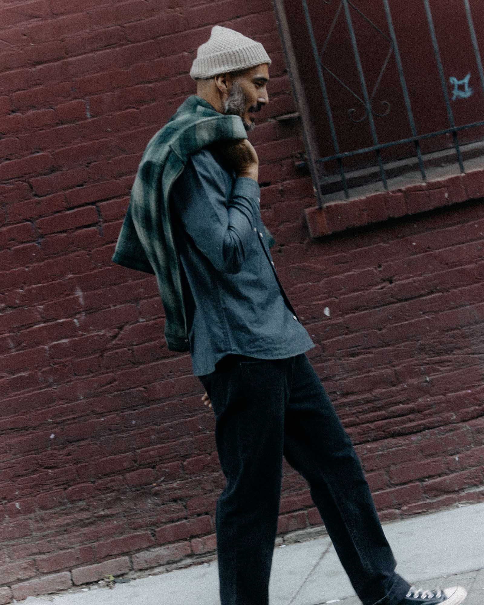 fit model showing off the collar on The Jack in Rinsed Indigo Chambray, Wovens by Taylor Stitch