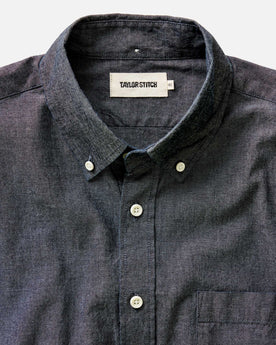 fit model sitting wearing The Jack in Rinsed Indigo Chambray, Wovens by Taylor Stitch