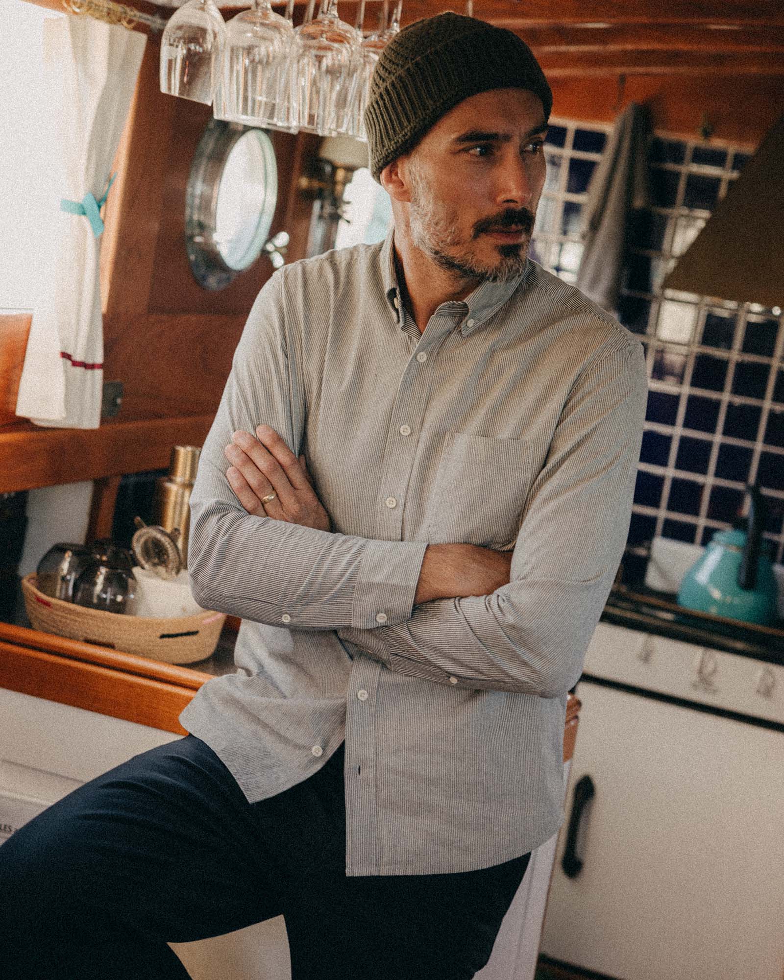 fit model posing in The Jack in Rinsed Indigo Stripe Chambray, Wovens by Taylor Stitch