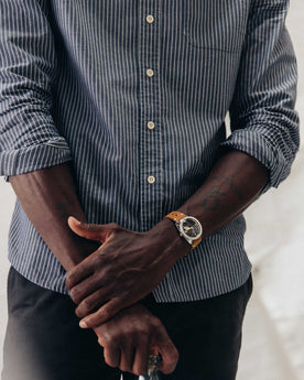 fit model with his arms crossed wearing The Jack in Rinsed Indigo Stripe, Wovens by Taylor Stitch