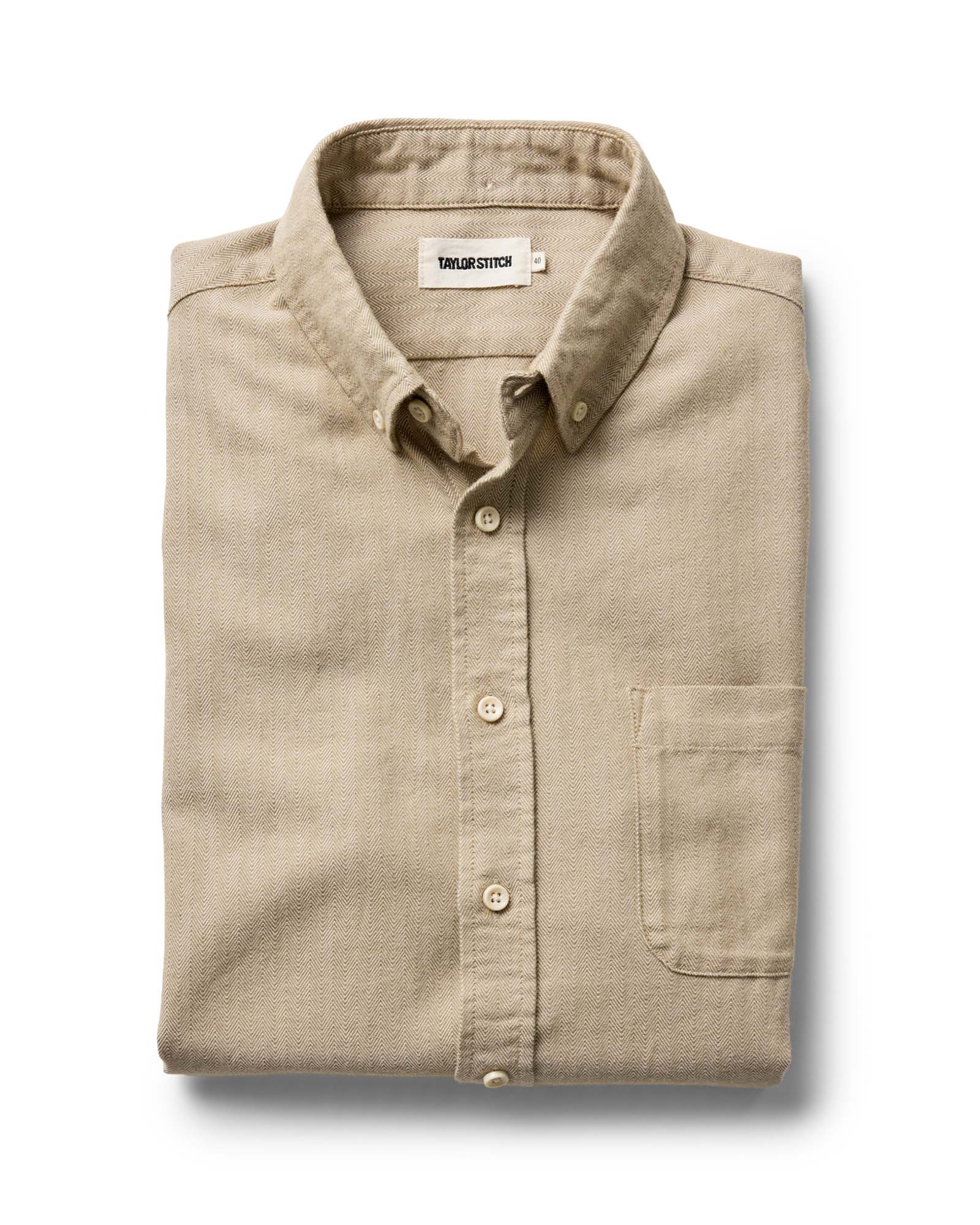 folded flatlay of The Jack in Sand Herringbone, Wovens by Taylor Stitch