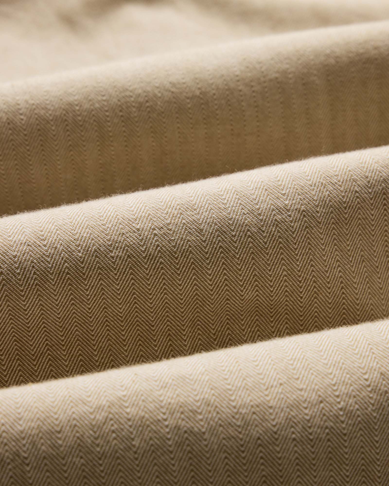 material shot of the fabric on The Jack in Sand Herringbone, Wovens by Taylor Stitch