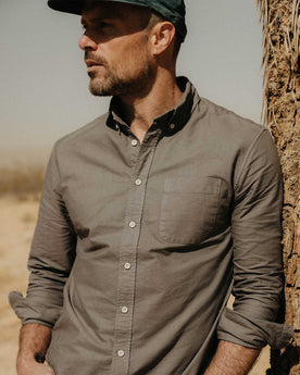 fit model sitting in The Jack in Smoke Oxford, Wovens by Taylor Stitch