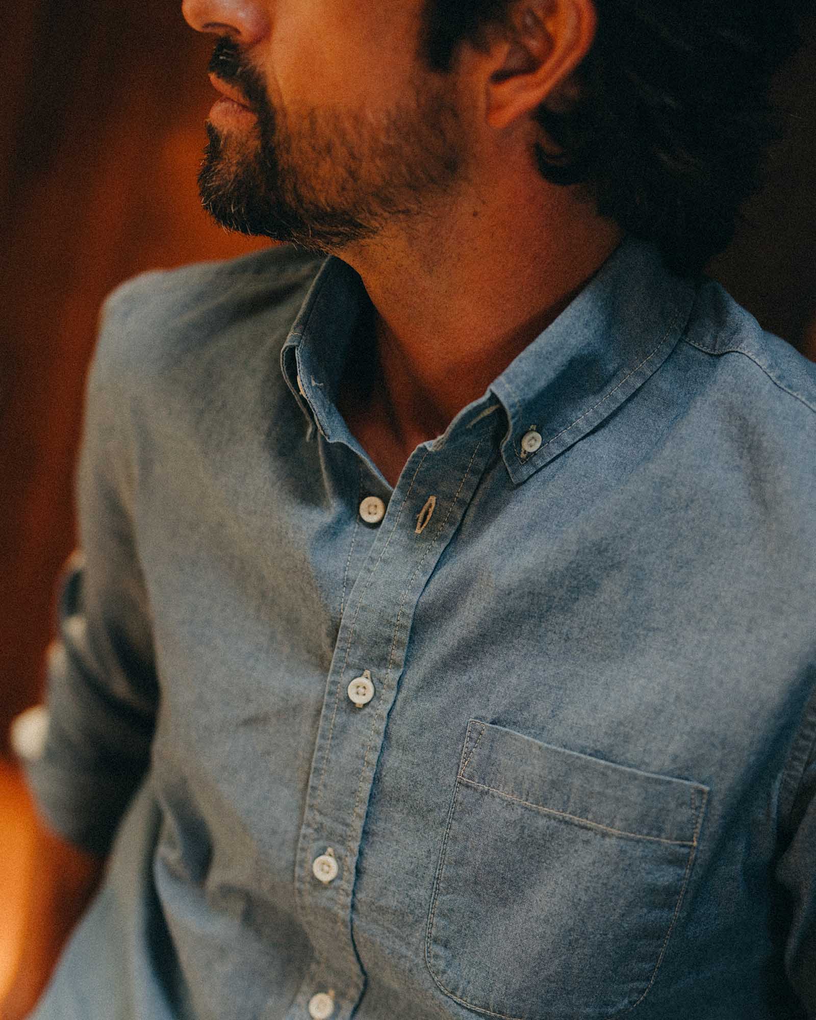 fit model showing off the collar on The Jack in Washed Indigo Chambray, Wovens by Taylor Stitch