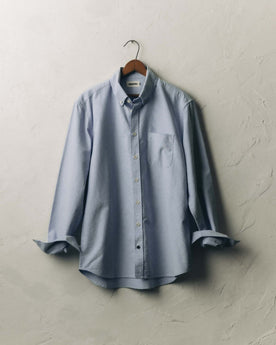 fit model with his hand in his pocket wearing The Jack in Blue Everyday Oxford, Wovens by Taylor Stitch