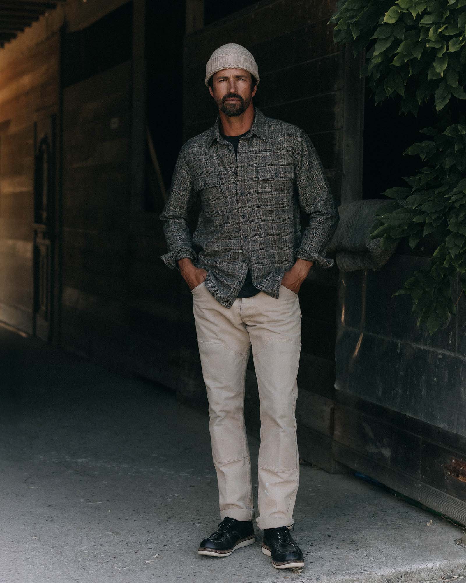 fit model posing in The Ledge Shirt in Coal Plaid, Wovens by Taylor Stitch