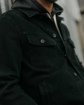 fit model showing off the pockets on The Long Haul Jacket in Black Indigo Waffle, Outerwear by Taylor Stitch