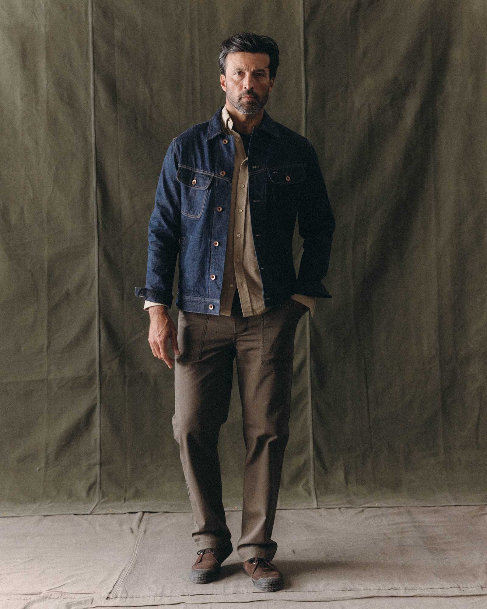 fit model standing wearing The Long Haul Jacket in Rinsed Organic Selvedge, Outerwear by Taylor Stitch