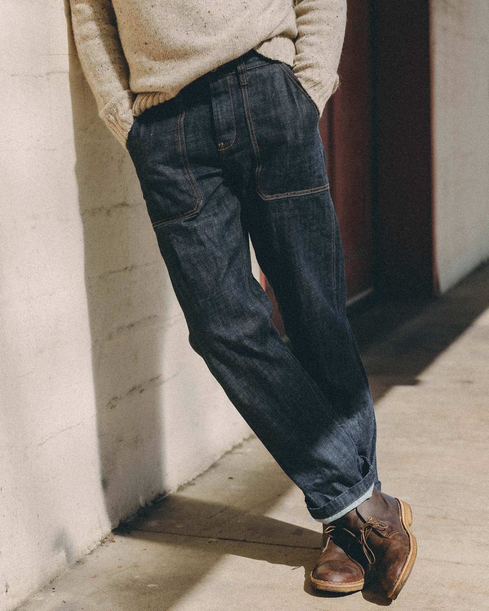 fit model posing in The Mariner Jean in Rinse Organic Selvedge, Bottoms by Taylor Stitch