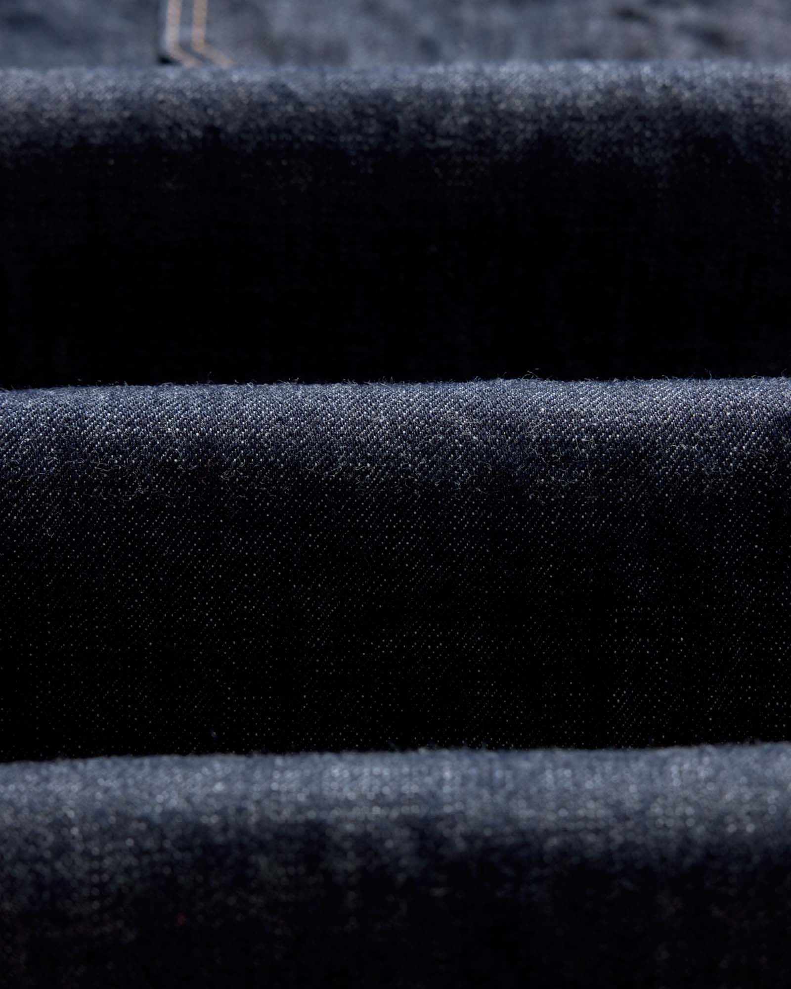 folded flatlay of the back of The Mariner Jean in Rinse Organic Selvedge, Bottoms by Taylor Stitch