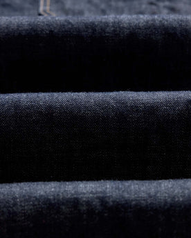 folded flatlay of the back of The Mariner Jean in Rinse Organic Selvedge, Bottoms by Taylor Stitch