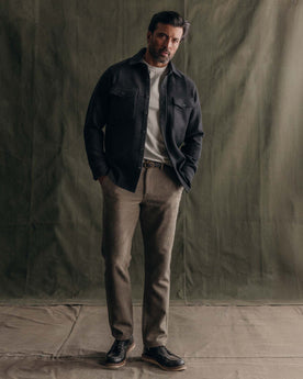 fit model standing wearing The Maritime Shirt Jacket in Heather Charcoal Wool, Outerwear by Taylor Stitch