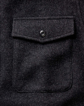 material shot of the pocket on The Maritime Shirt Jacket in Heather Charcoal Wool, Outerwear by Taylor Stitch