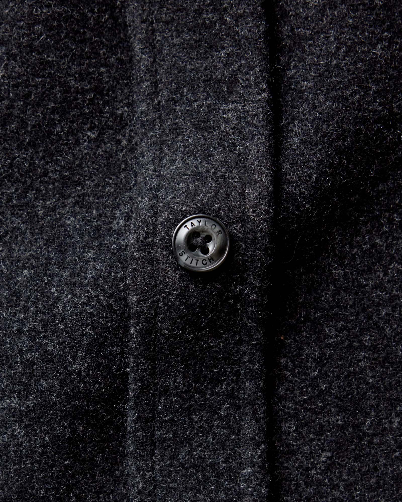 material shot of the buttons on The Maritime Shirt Jacket in Heather Charcoal Wool, Outerwear by Taylor Stitch