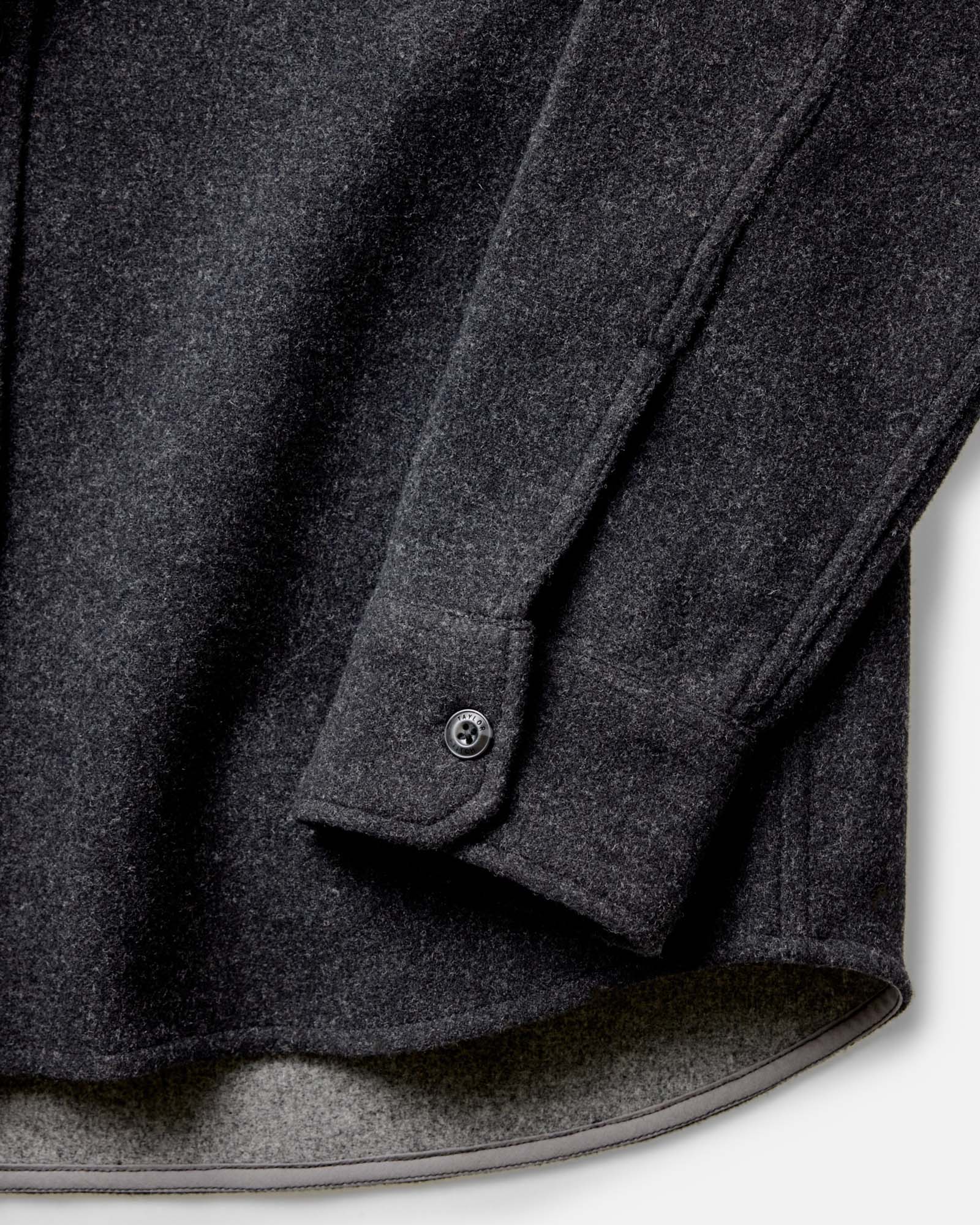 material shot of the sleeves on The Maritime Shirt Jacket in Heather Charcoal Wool, Outerwear by Taylor Stitch