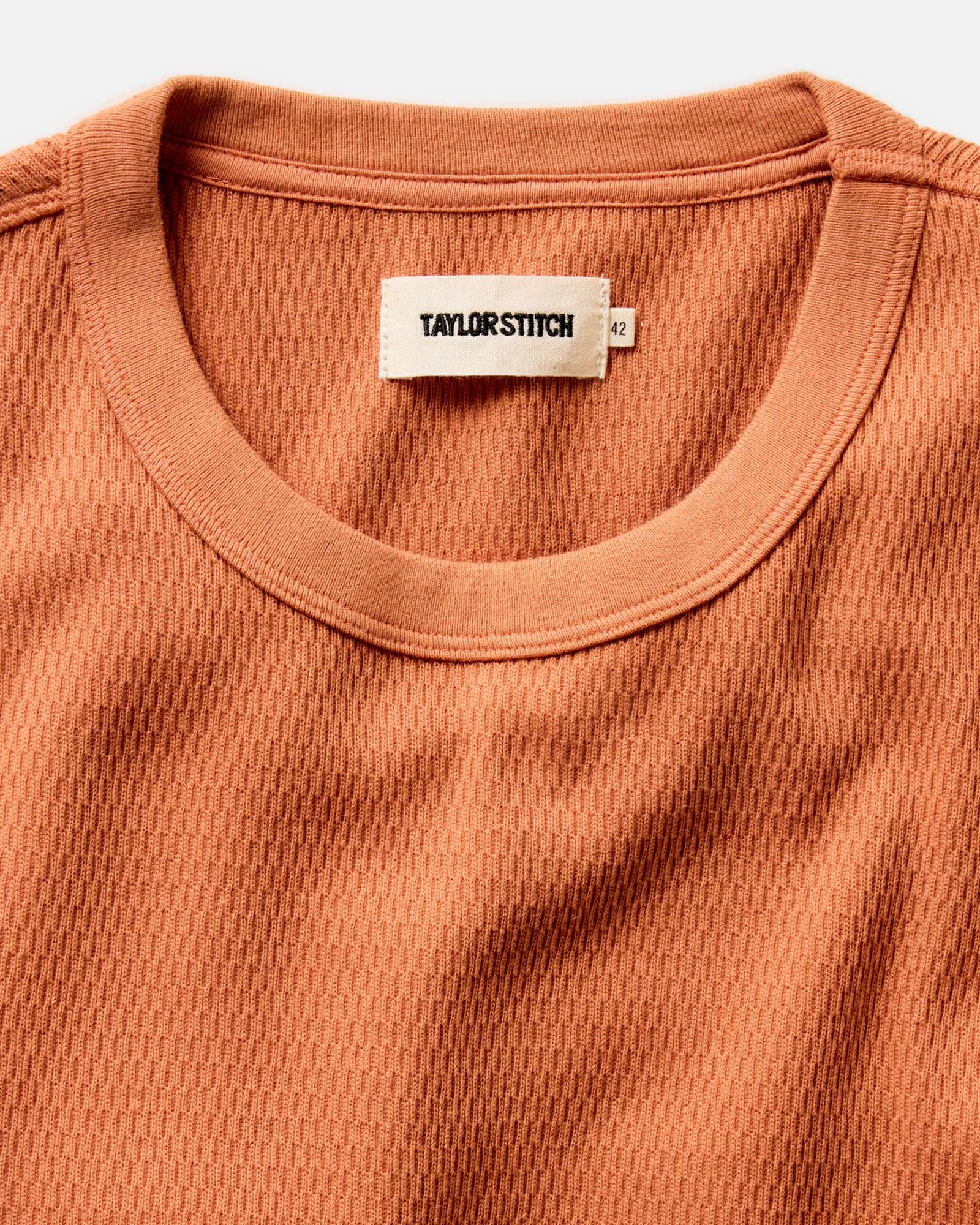 material shot of the collar on The Organic Cotton Crew in Summit Orange Waffle, Knits by Taylor Stitch