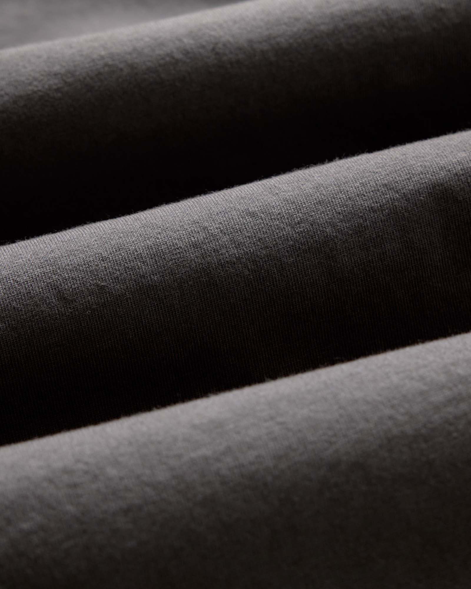 material shot of the fabric on The Organic Cotton Long Sleeve Tee in Faded Black, Knits by Taylor Stitch